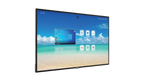 Large flat-screen television displaying a beach scene with a blue sky and white clouds.